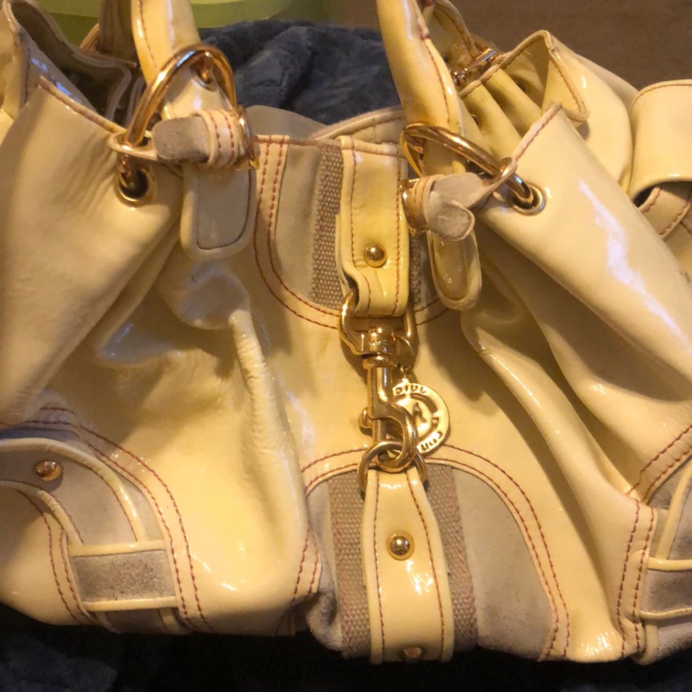 White leather and suede juicy couture purse.